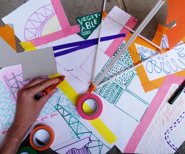 Colourful paper, ribbons and tape with children's hands