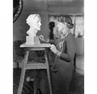 Portrait of Lady Kathleen Scott working on a bust