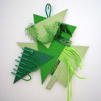 Collected Colours A collection of green shapes forming a collage hanging on a wall