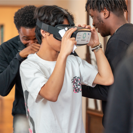 A young person looking through a VR headset