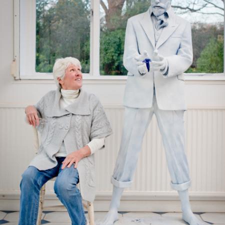 Sculptor Diana Thomson next to the plaster figure of DH Lawrence